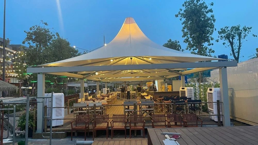 Resort poolside tensile umbrella canopy